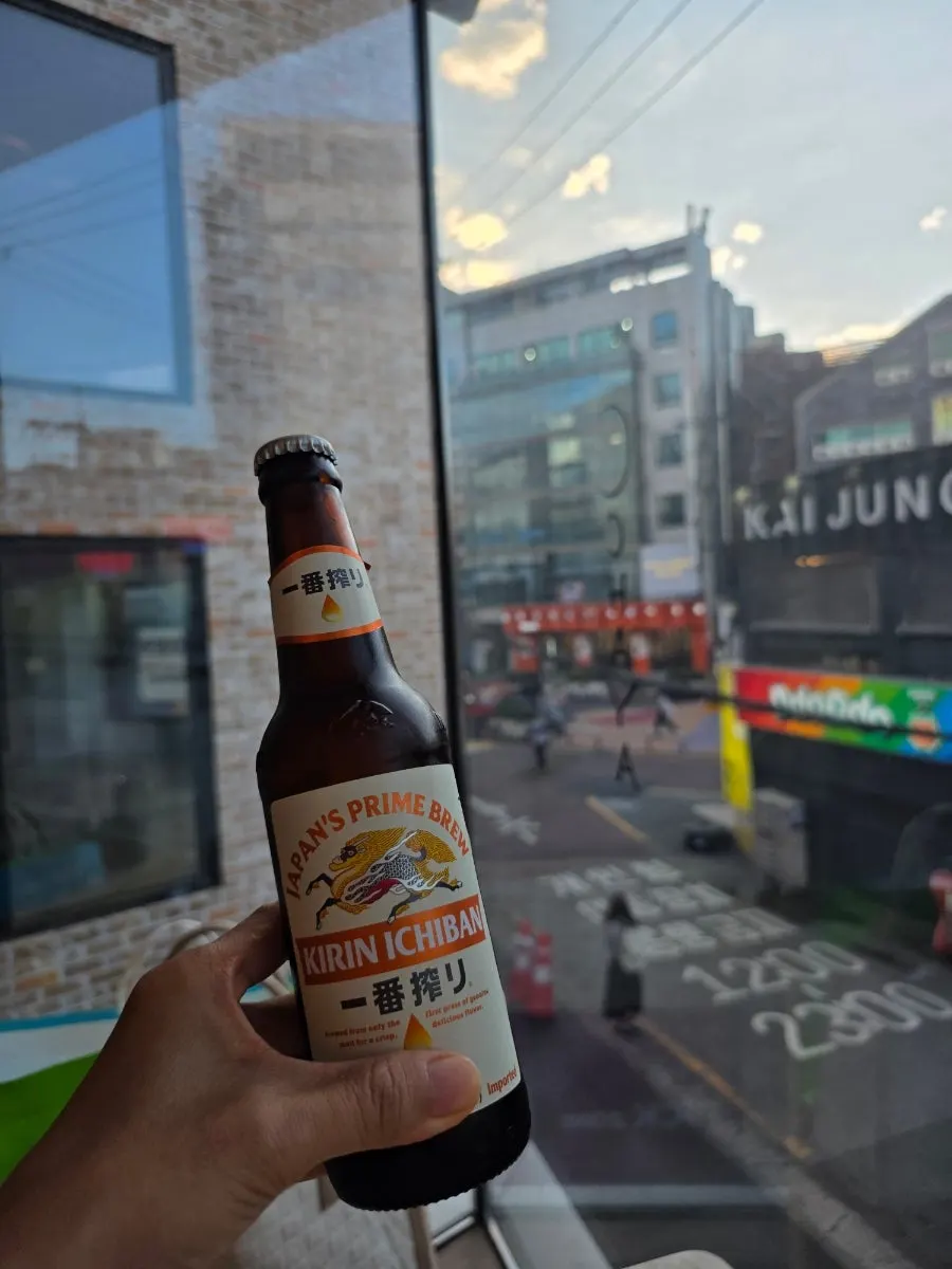 A glass of foamy Kirin beer