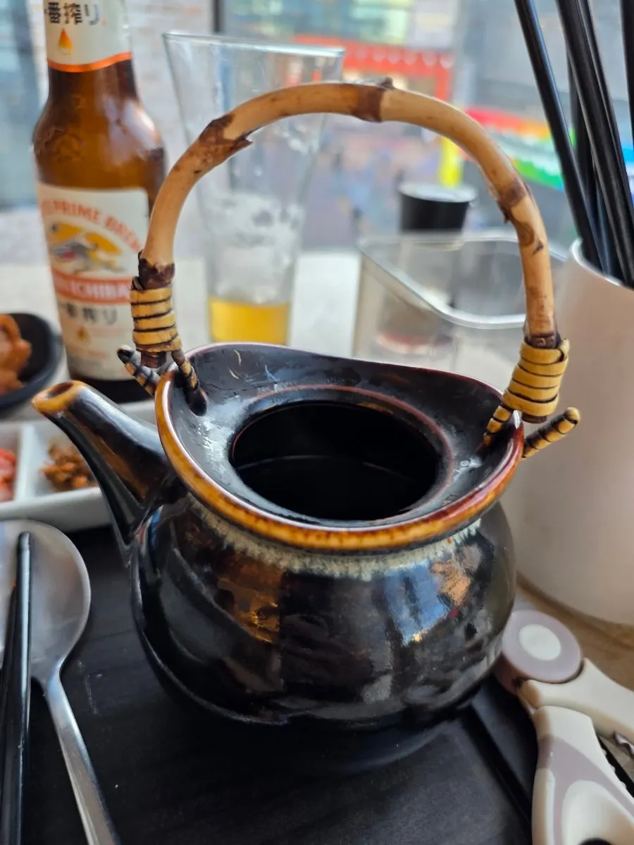 Sake chazuke served with a black teapot