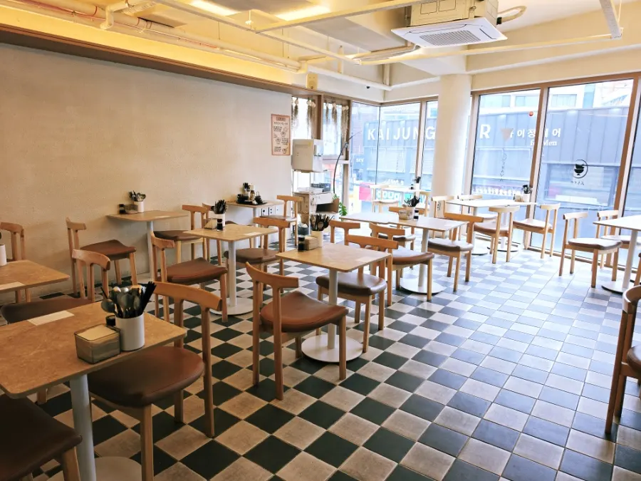 Interior of Ochaya with tables for one or two people