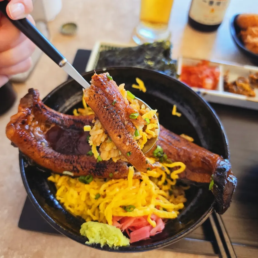 Eel meat splitting apart easily with chopsticks