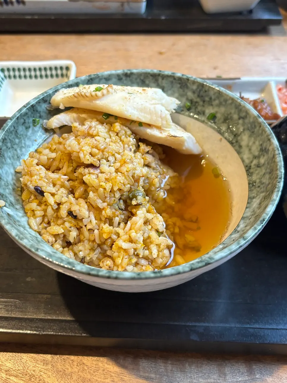 A bite of rice topped with butanokakuni meat