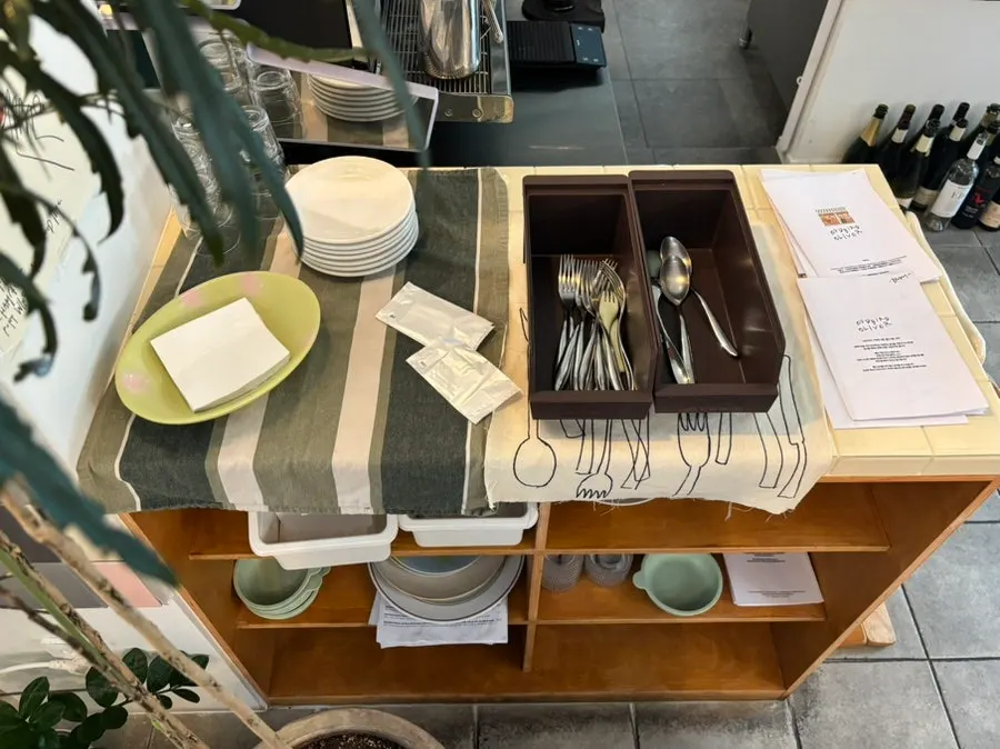 Self bar with cutlery and plates