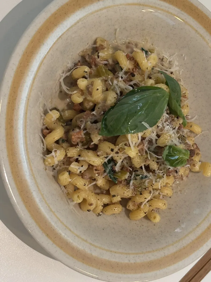 White ragu pasta with short curly noodles and ground meat