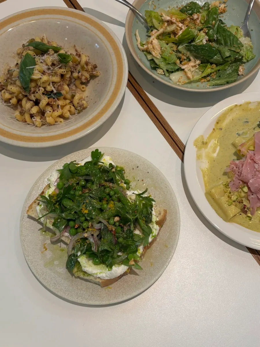 Cross-section of the open sandwich topped with herbs