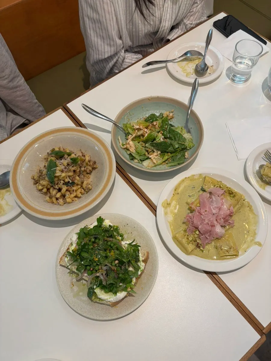Table with pasta and sandwich together