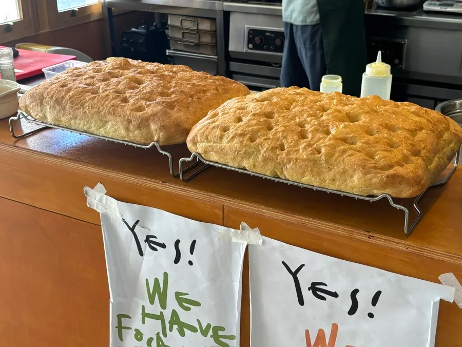 Focaccia and open kitchen visible from the entrance