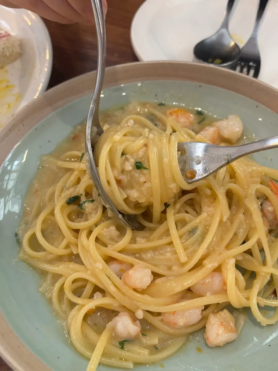 Close-up of the oil pasta topped with bottarga