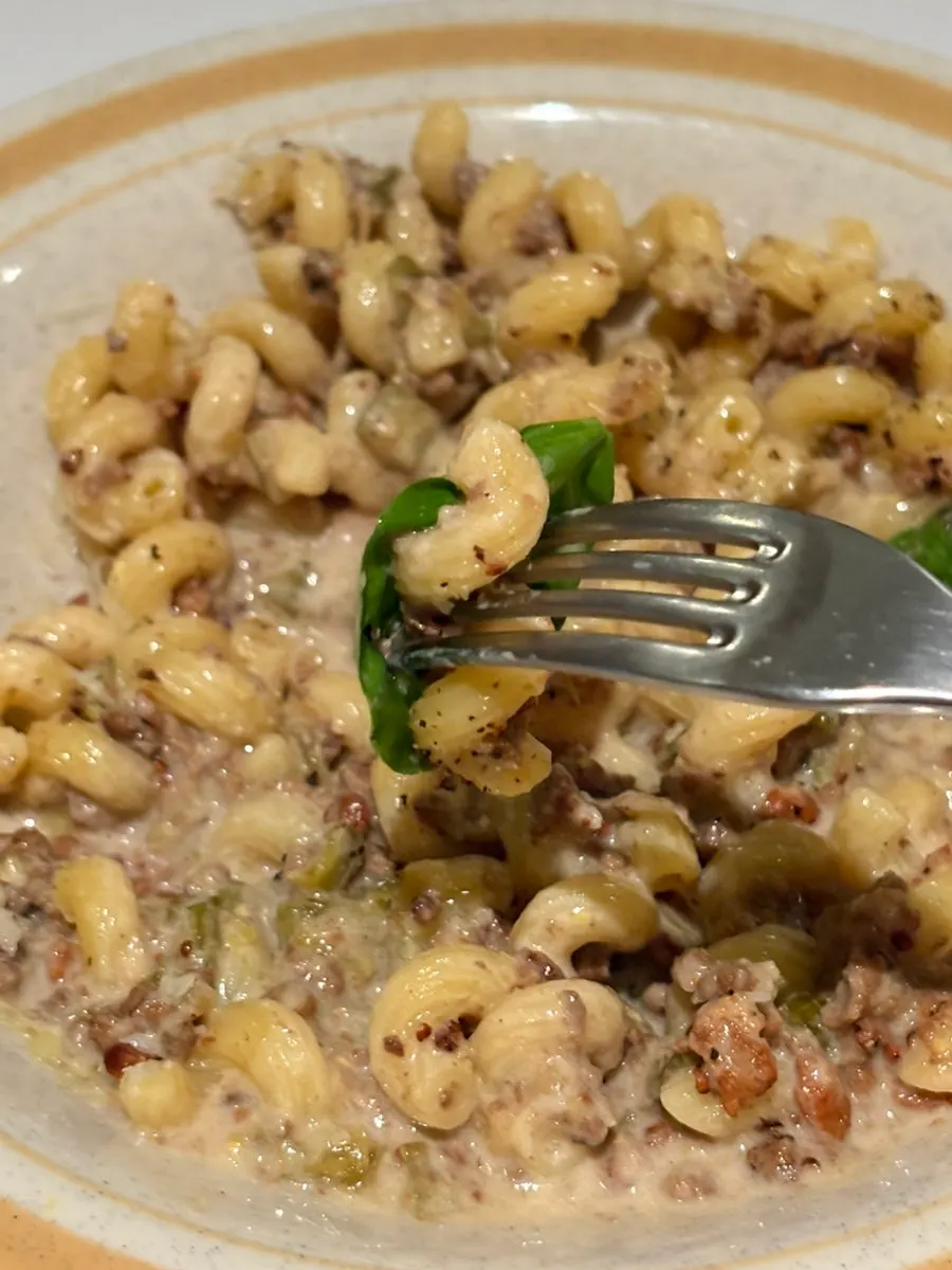 Riccioli pasta twirled around a fork
