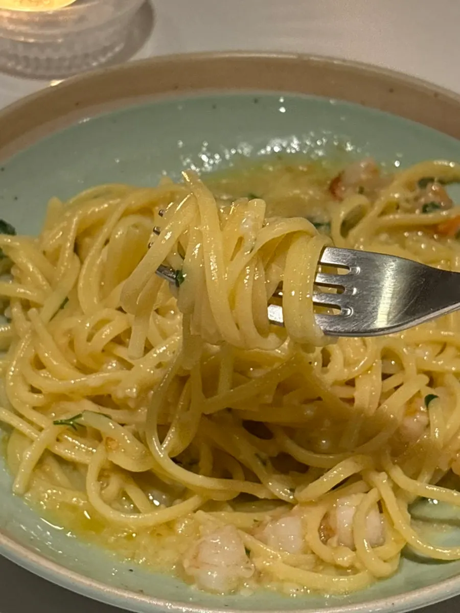 Mixing the bottarga aglio e olio