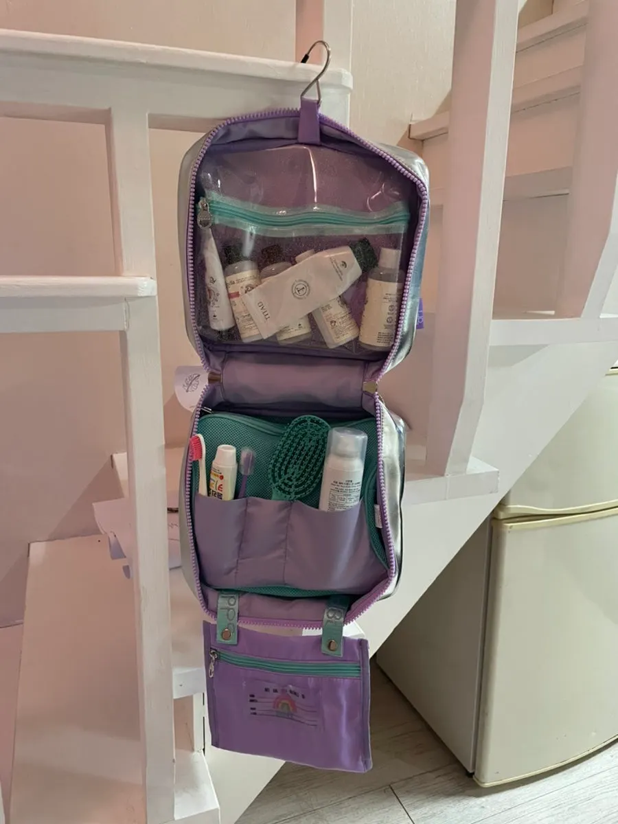 Wash bag interior with pockets in different sizes