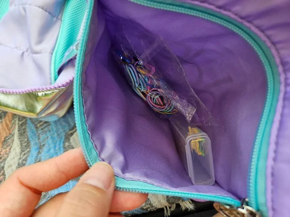 Detachable mini pouch at the bottom