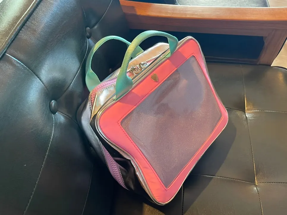 Wash bag hanging in a hotel bathroom