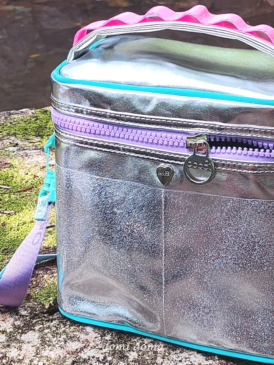 Cooler bag storage and strap features