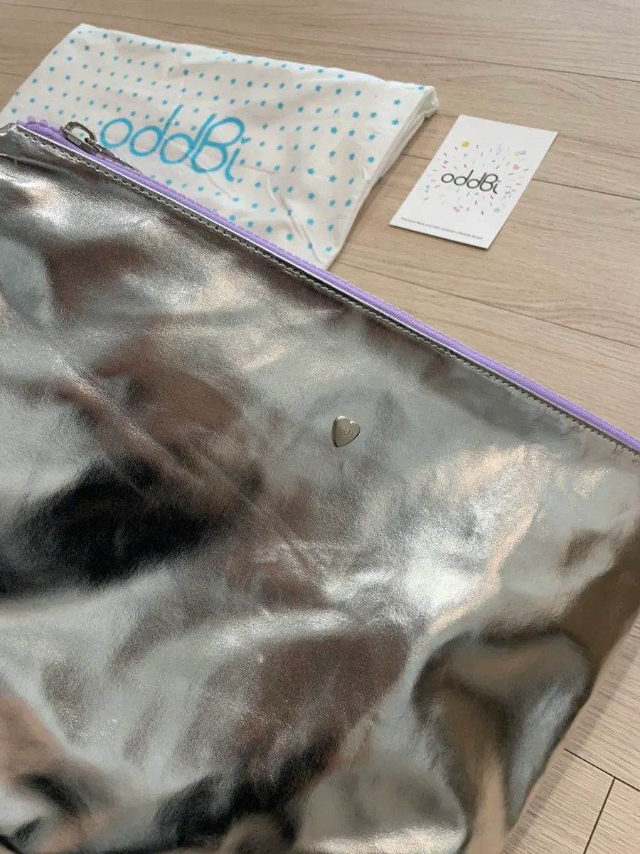 Detachable inner bag with a strap