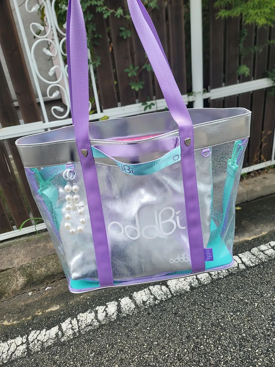 Clear silver bag styled with a navy outfit