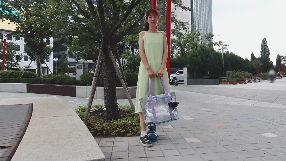 Beach bag worn with a sleeveless dress