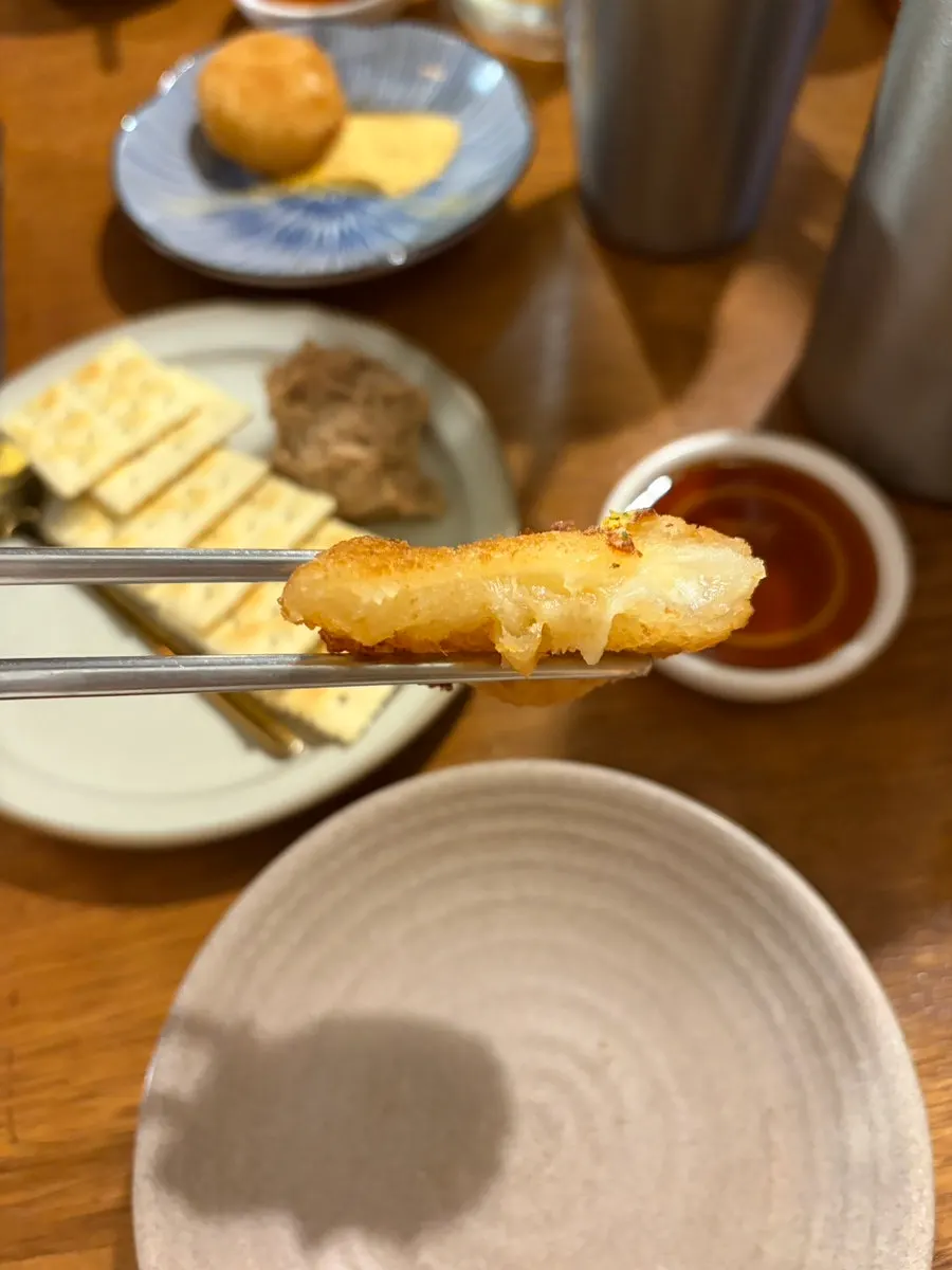 Plate of cheese balls with cheese powder served on the side