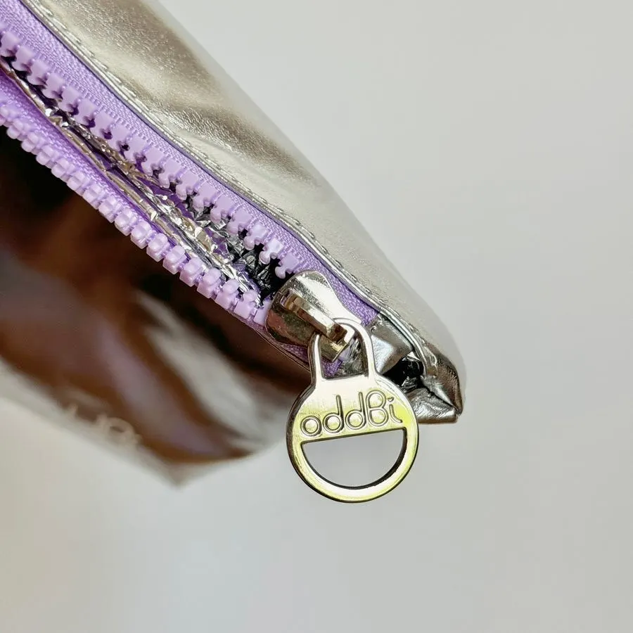 Heart-rivet detail on the beach bag