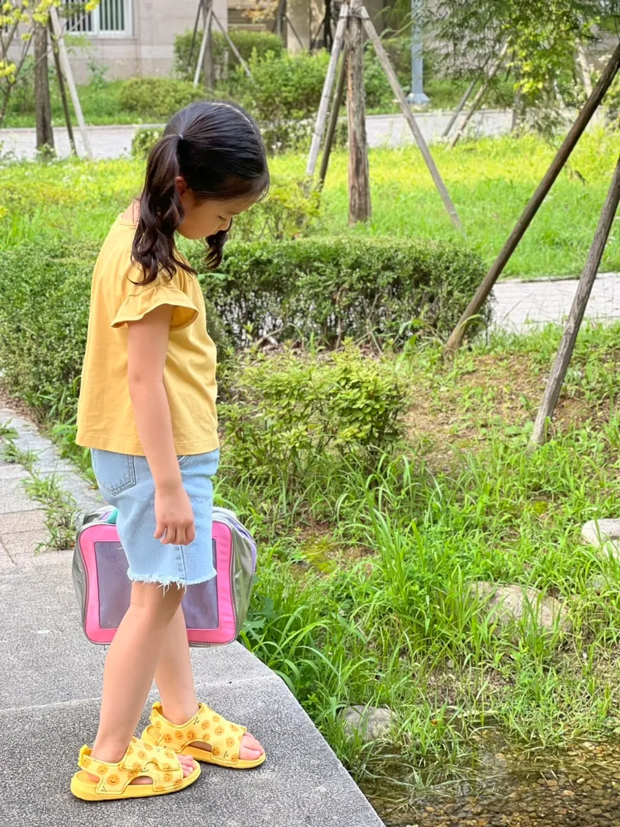 A child and a travel toiletry bag