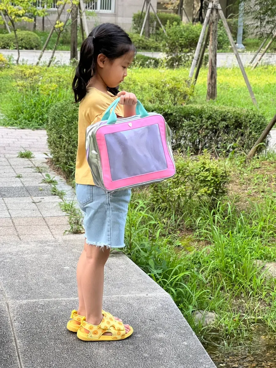 Showing the hanging wash bag to a child