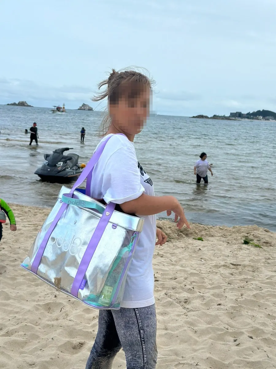 Beach bag in use with spare clothes inside