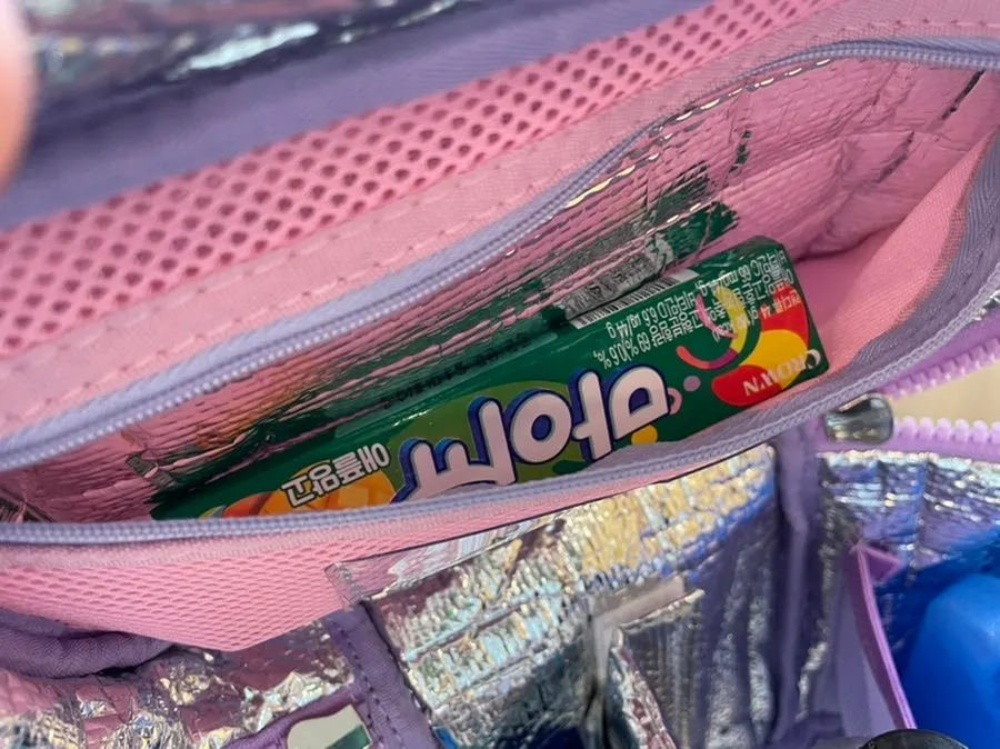 Side pocket holding an ice pack and drinks
