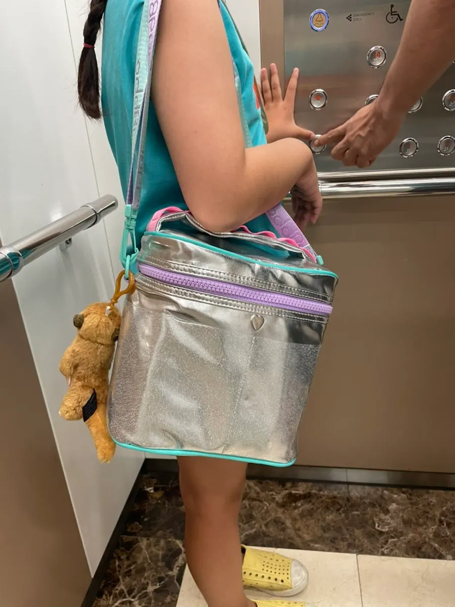 Insulated bag with a detachable strap