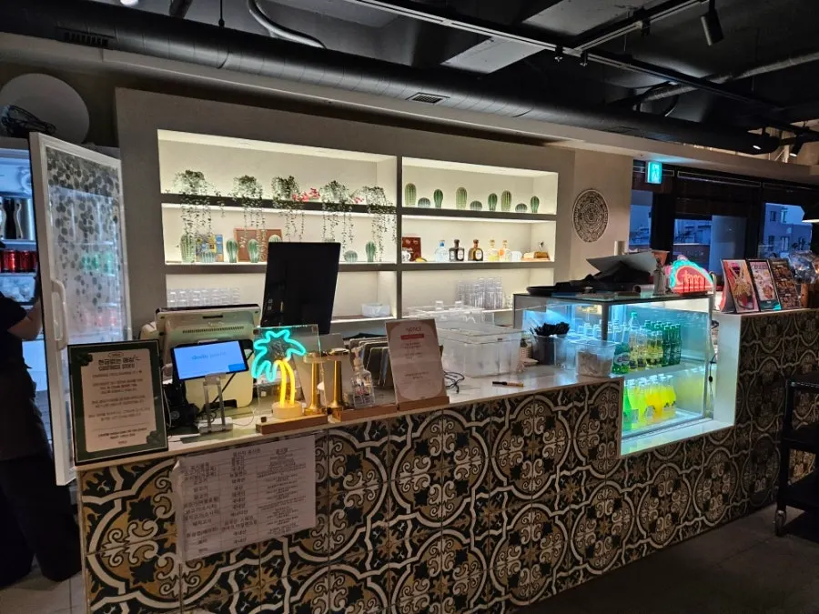 Restaurant counter with geometric-patterned tiles