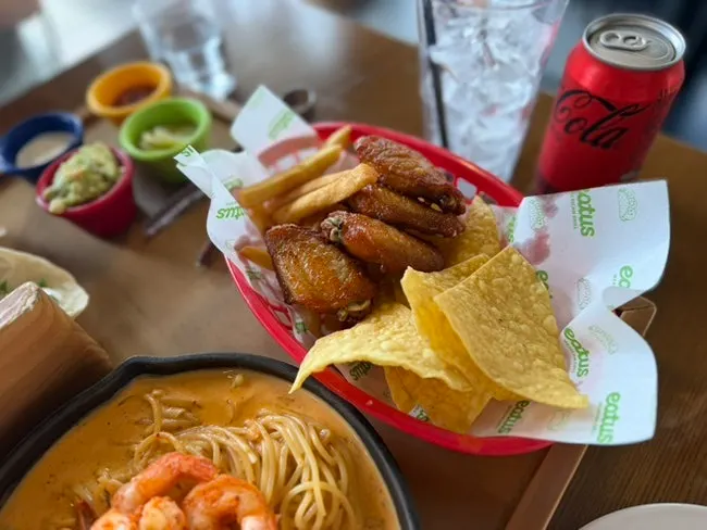 Platter with tacos and Buffalo wings