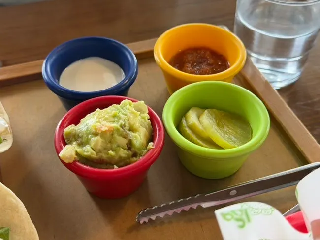 Platter with nacho chips and sauces