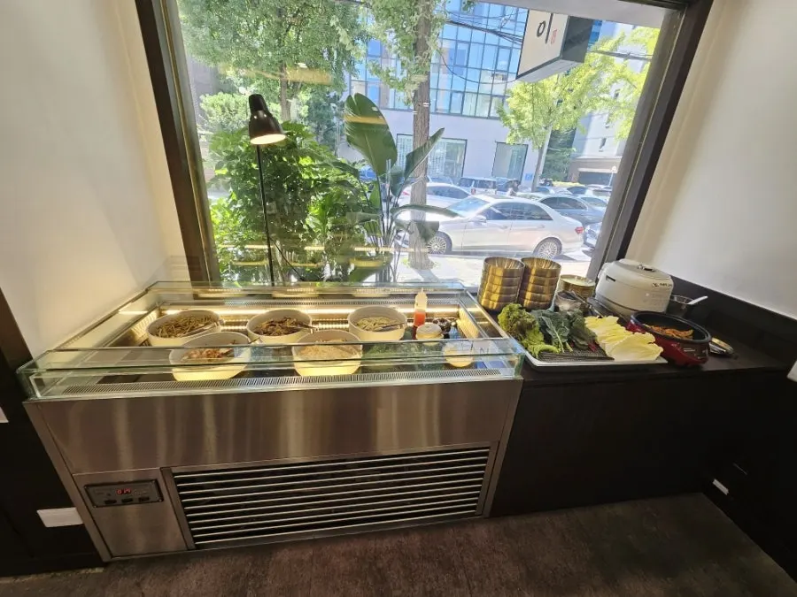 Ssam vegetables and side dishes at the self-service bar