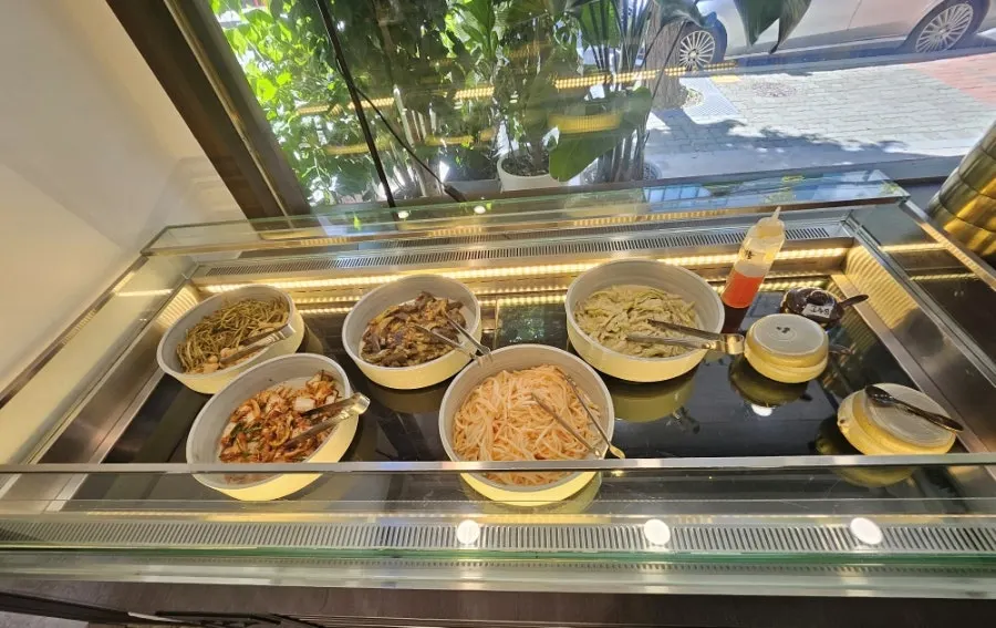 A self-service bar stocked with a variety of ssam vegetables