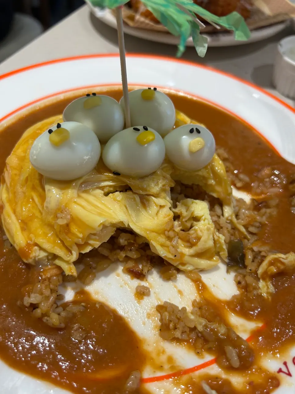 Spoonful of salmon fried rice from inside the omurice