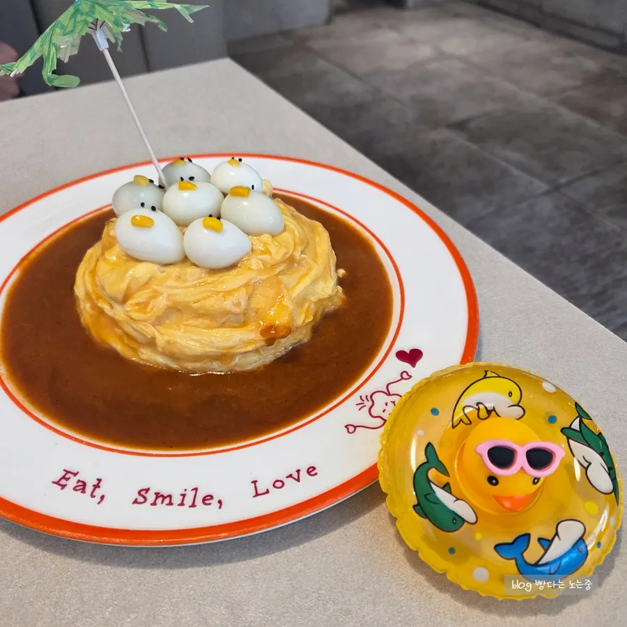 Table setup with rubber duck omurice