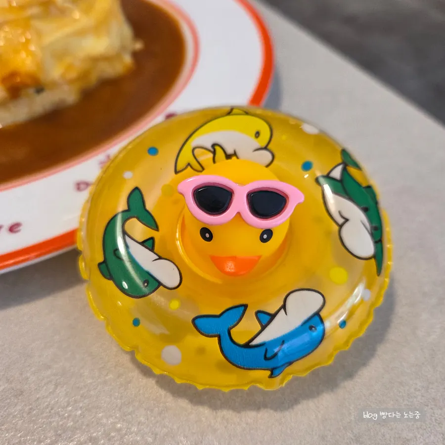 Rubber duck omurice with quail eggs shaped as a duck face