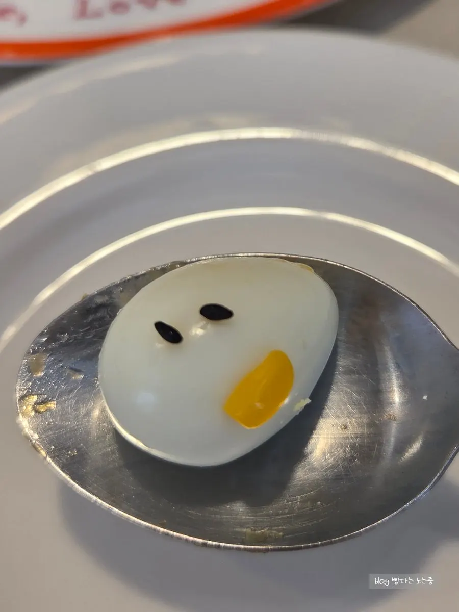 Bite of omurice topped with quail egg
