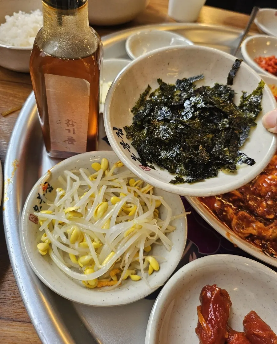 Octopus bibimbap mixed with sesame oil and roasted seaweed flakes