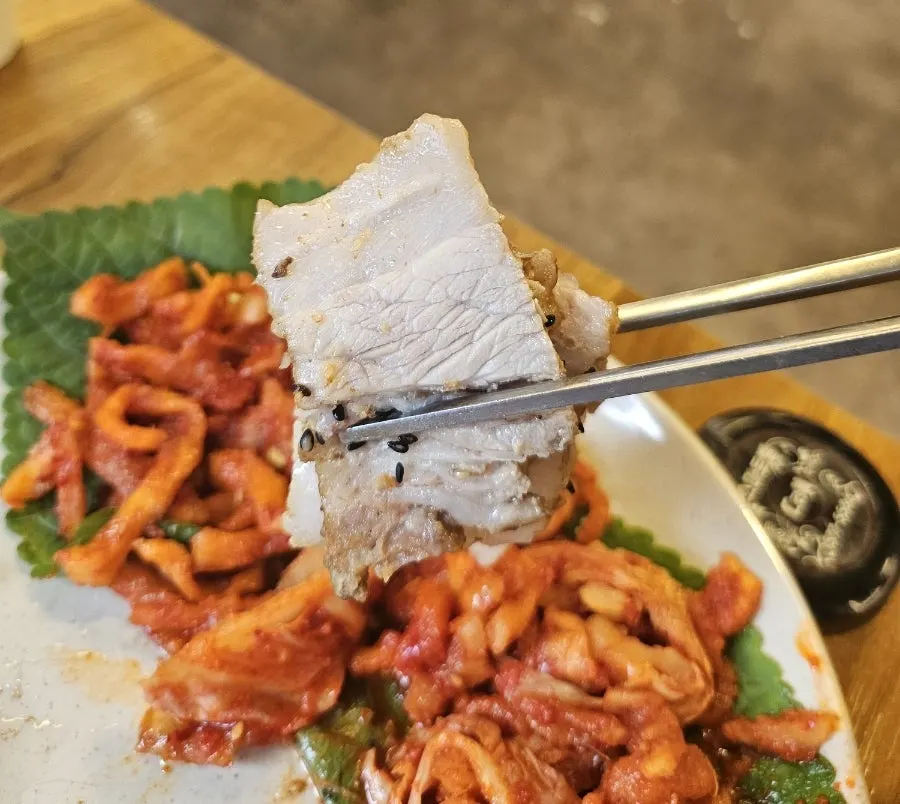 Table spread with bossam and radish kimchi