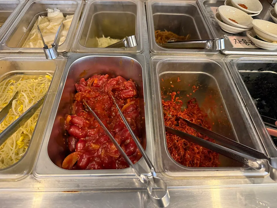 Table with octopus stir-fry and side dishes