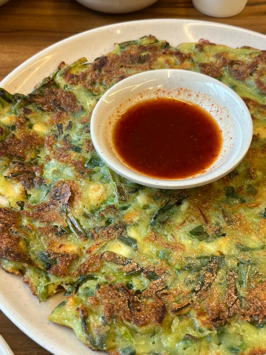 Picking up a piece of buchujeon