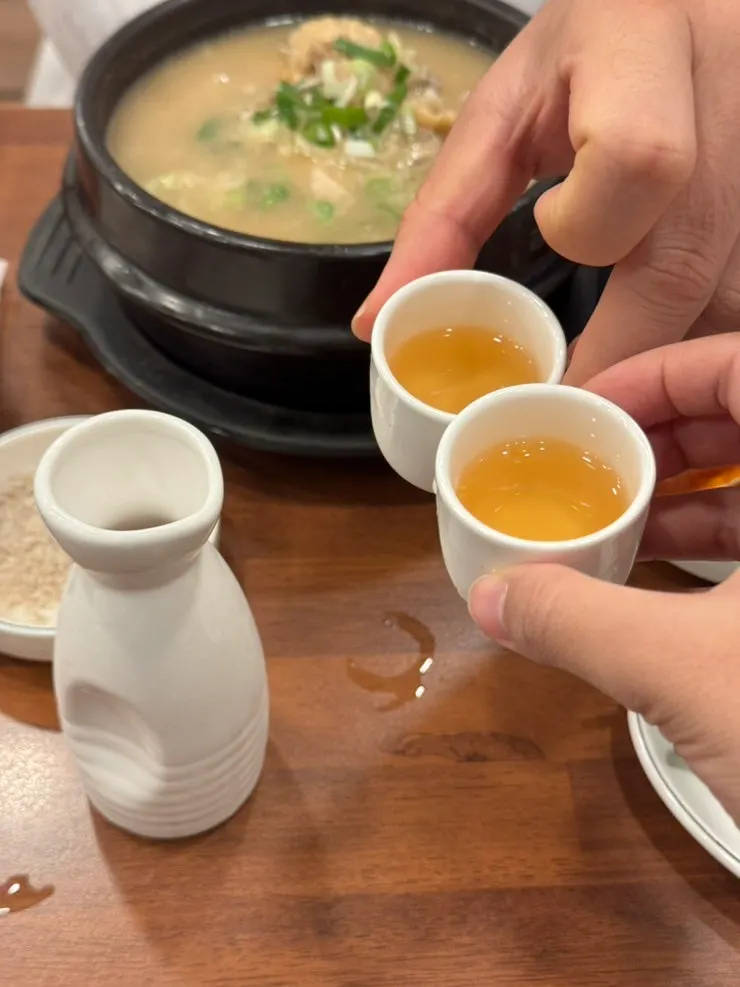 A cup poured with golden ginseng wine