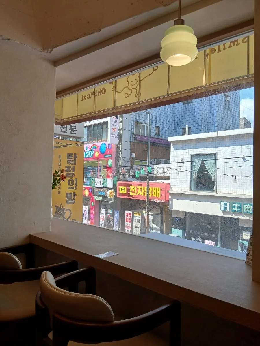 Interior of Omil Hyehwa in white and wood tones