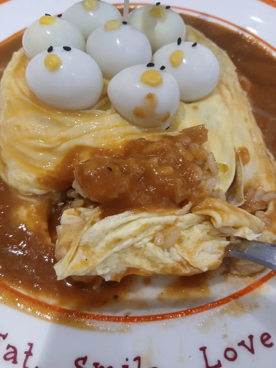 Fried rice underneath the swirled egg