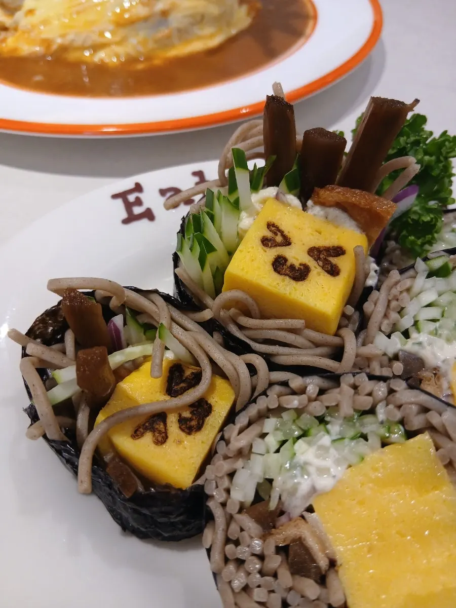 A plate of Omil soba maki rolled in seaweed