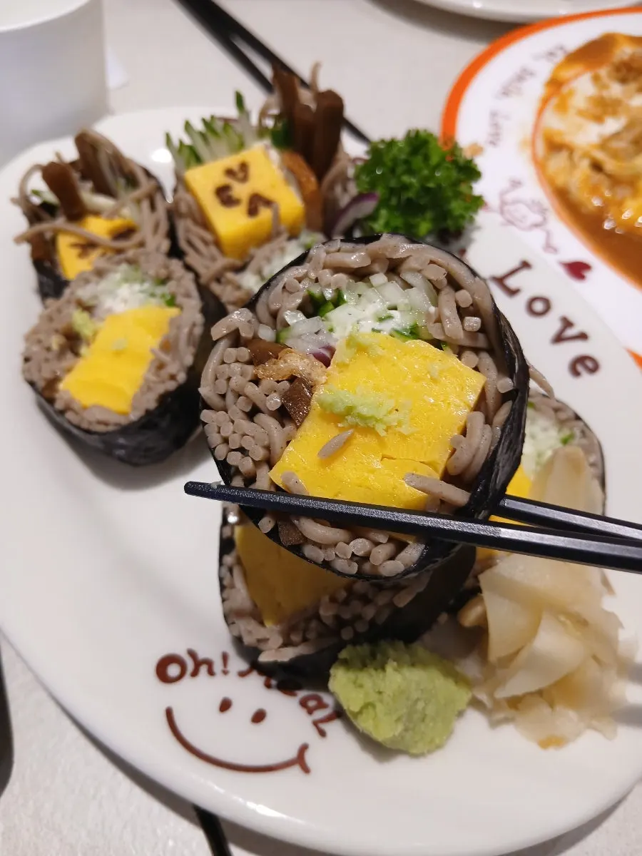 Cross-section of soba maki showing buckwheat noodles and vegetables