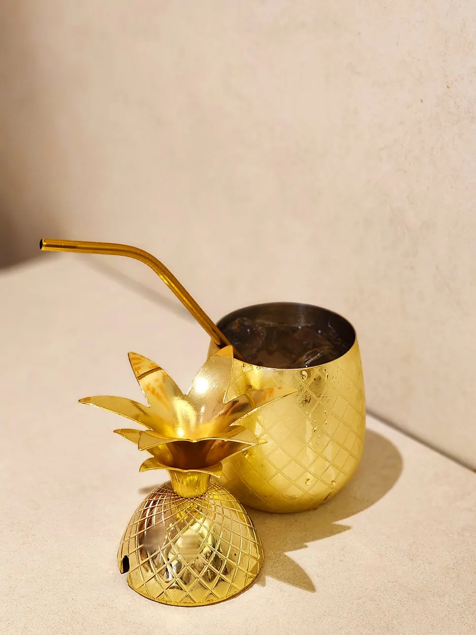 Close-up of the golden pineapple-shaped glass