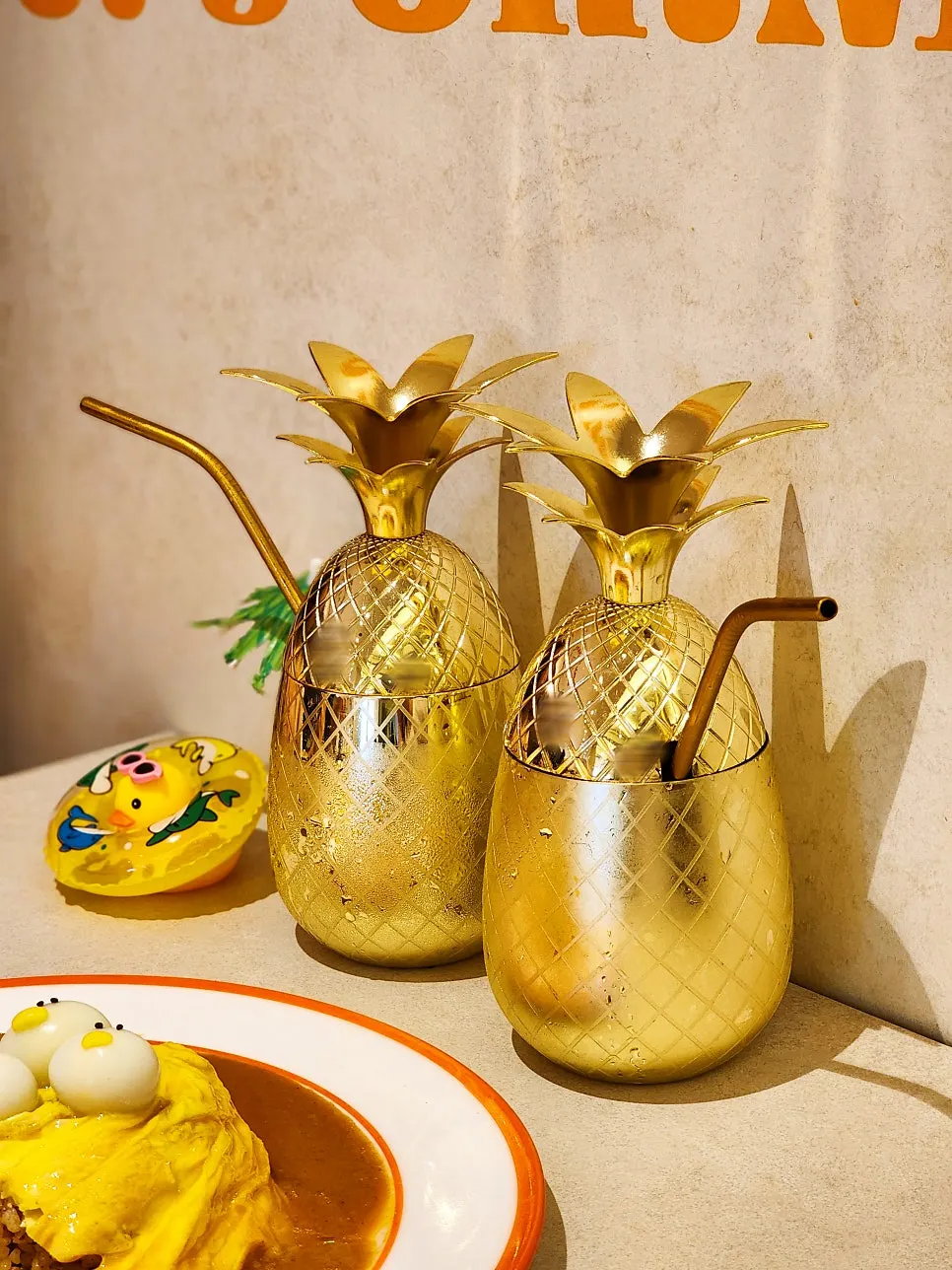 Two glasses of pineapple ade on the table