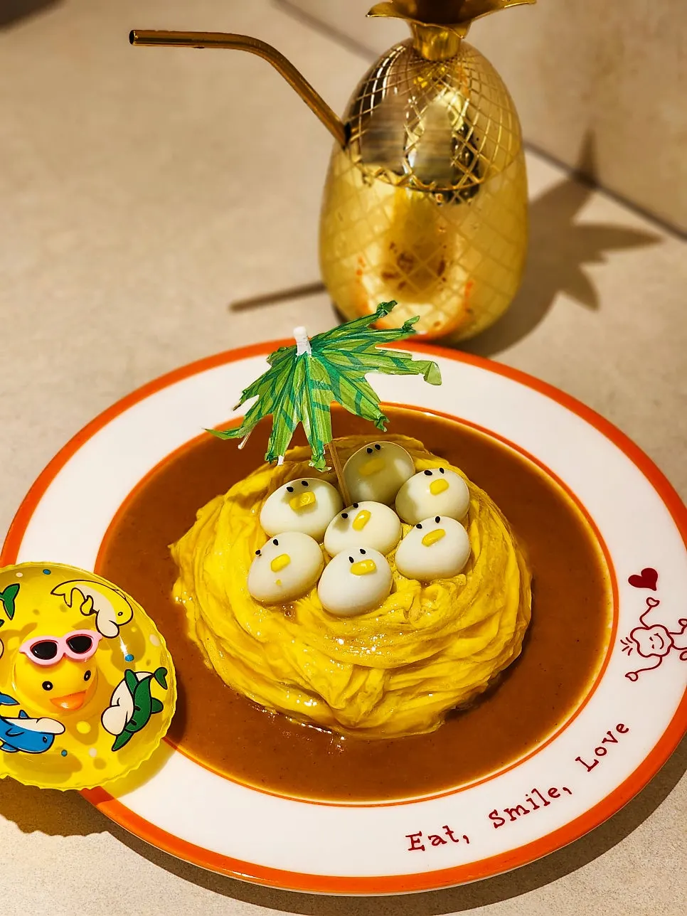 Rubber duck omurice topped with duck-shaped quail eggs