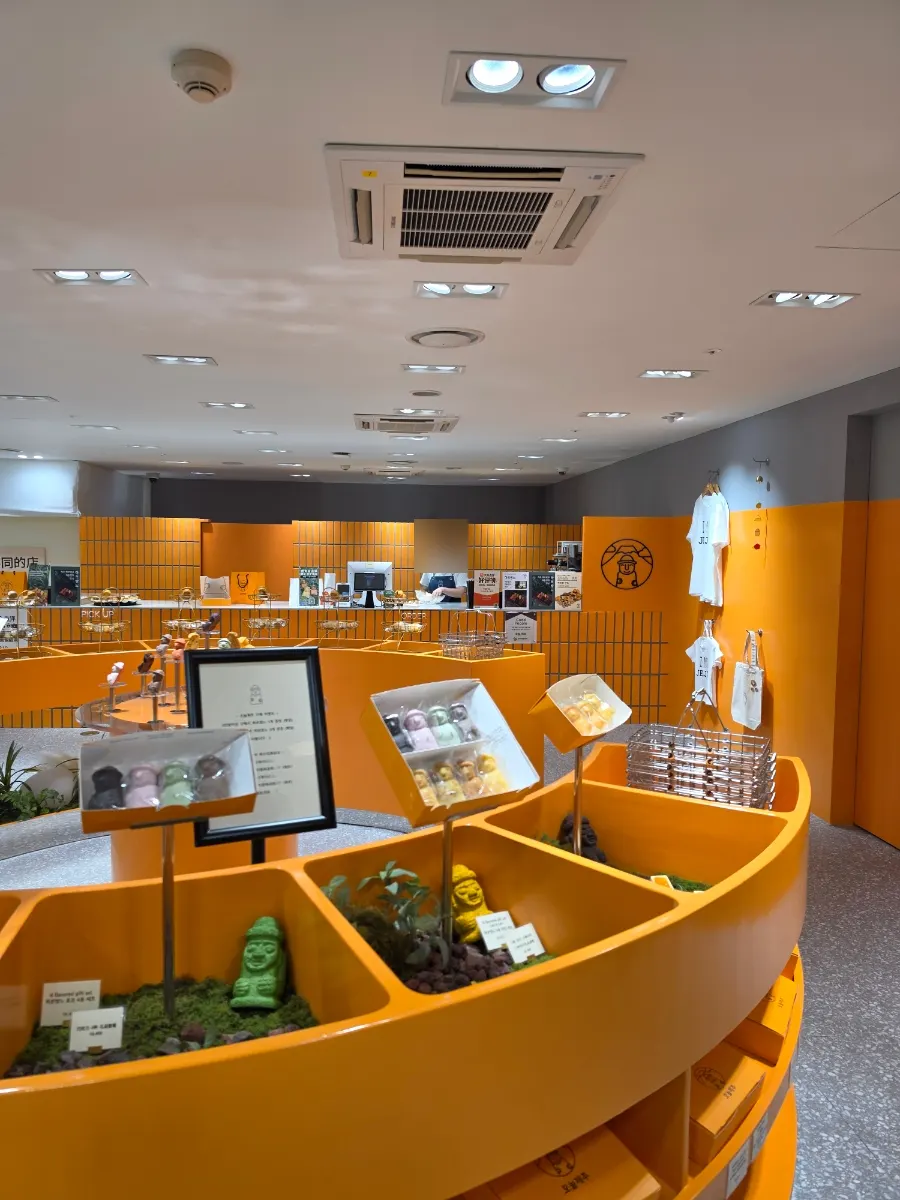Interior display shelves of Today Jeju decorated in orange