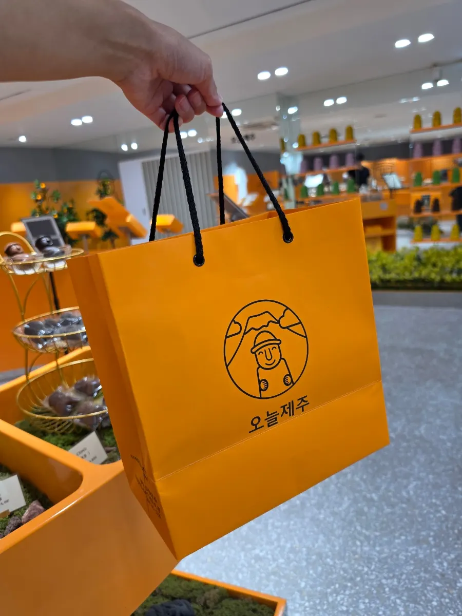 Today Jeju postcards and keyring merchandise on a shelf